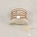 Bohemian rose gold 5-piece bead bracelet set with love charm and baroque pearl on sand - Rose Gold