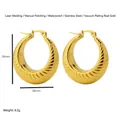 Detail of 28mm gold hollow C-shape earrings with spiral texture and waterproof plating - Hollow Striped Round Hoop Earrings / Gold