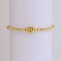 18k gold plated Virgo zodiac charm beaded elastic bracelet shown on a white display stand - Virgo