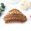Elegant amber brown leaf-shaped hair claw clip with matte finish and hollow design - Jelly Brown