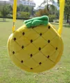 Detail of pineapple plush crossbody bag with textured yellow fabric and green leaves - Pineapple