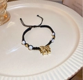 Handmade black cord bracelet with gold bow charm and white pearls, adjustable size - Black