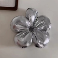 Detail of silver metallic flower hair scrunchie showing the soft reflective fabric texture - Bright Silver Metallic / Silver