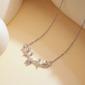 Silver-colored antler and flower necklace with sparkling zircon accents on a beige background - XL1231 Flower Deer Horn Silver