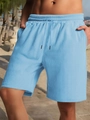 Detail view of light blue men's shorts showing knitted texture and drawstring waistband - S / Light Blue