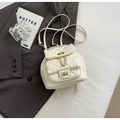 Chic cream white quilted mini backpack featuring gold chain straps and turn-lock closure - Small / Off White
