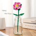 Pink building block rose in glass vase on wooden table for home decoration - Hibiscus 260-29 / Bag Packaging