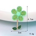 Detail view of a green rhinestone flower charm with dimensions 4.7cm height and 3cm width - D1505 Green Flower