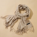 Classic beige cashmere scarf for women with elegant fringe details and soft texture - Khaki