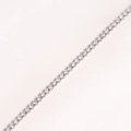 Detailed close-up of a silver tennis bracelet with brilliant cubic zirconia in a prong setting - Platinum - White Zirconia