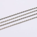 Detailed close-up of antique bronze finish metal link chains for DIY jewelry making - Antique Bronze