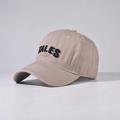 Close-up of TALES heavy embroidery and textured cotton fabric on khaki baseball cap - Khaki