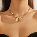 Golden chunky chain necklace featuring a bold bow pendant worn by a professional model - Gold Bowknot