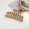 Detailed macro view of a large matte beige shark hair claw clip for thick hair styling - Keel / Light Coffee