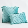 Teal velvet throw pillows with diamond quilted pattern and decorative pom-pom edges - Aqua Green