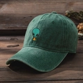 Unisex Y2K washed cotton baseball cap with alien pizza embroidery on rustic wooden desk - One Size / Dark Green