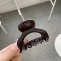 Detailed close-up showing the glossy brown finish and square design of the hair claw clip - Chocolate