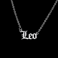 Macro detail of silver stainless steel Leo zodiac necklace with gothic font pendant - Leo-Silver