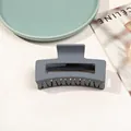 Detail view of large matte grey hair claw clip showing smooth finish and durable spring - 8.5cm Rectangular - Matte Blue Grey