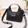Black quilted handbag with gold Sunnycity logo and wide letter-printed shoulder strap - Black