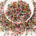 Close-up of colorful square faceted glass beads for DIY jewelry making in a white bowl - Mixed Color