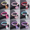 Colorful children's pearl bracelets featuring various cartoon character pendants - A25 Pendant Bracelet