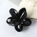 Black glossy flower hair claw clip in a plumeria design with a polished resin finish - Glossy Black