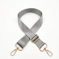 Detail of adjustable grey nylon bag strap with polished gold metal buckles and hooks - Light Gray