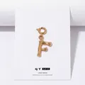 Bamboo style letter F pendant in gold-plated brass with a polished metallic finish - Letter F