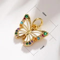 Detailed macro view showing a 13mm x 11mm gold butterfly pendant with colorful gemstones - A0075 Rhinestone Butterfly