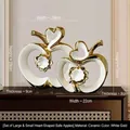 Set of two white and gold ceramic apple statues in large and small sizes - White Gold Heart Apple Pair