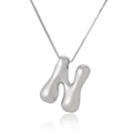 Detailed close-up of a 3D puffy silver letter N pendant with a venetian box chain - Letter N