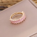 Detailed view of pink rectangular zirconia stones set in a gold-plated adjustable ring band - Adjustable Open / Pink