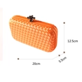 Orange woven evening clutch bag with dark metal twist lock and 20x12.5x5.5cm size guide - Orange
