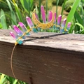 Macro detail of handmade bohemian crown featuring gradient crystals and a golden moon - Red Green Crystal Gold Wire Gold Moon
