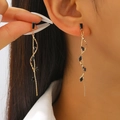 Elegant gold-tone tassel earrings with black marquise rhinestones on a female model - Gold with Black Zircon Style (1643)