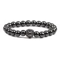 Detail of beaded black stone bracelet with a metallic lion head centerpiece bead - Black Lion Head