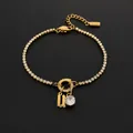 14K gold plated stainless steel tennis bracelet with letter U and rhinestone charm - Letter U