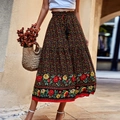 Jupe longue bohème à taille haute noire avec fleurs jaunes et bordure rouge chic - Noir