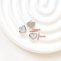 Macro detail of 10x9mm heart-shaped silver charms in solid and mother-of-pearl inlay - 8# Silver Mother Of Pearl Heart Pendant (10x9mm)