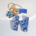 Blue resin letter H keychain with butterfly charm and tassel gold ring ornament - Letter H