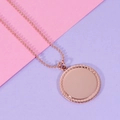 Macro detail of rose gold ball chain and textured round pendant with mirror finish - Rose Gold Plated (MP097)