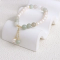 Elegant natural pearl bracelet with green and grey mineral beads and a golden tassel - 24 Tianshan Green Stone Pearl Bracelet