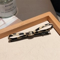 Stylish leopard print bow hair clip with gold metal accent and black base clip - 3D Light Leopard Bobby Pin