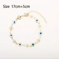 Gold star and evil eye bracelet with blue bead and adjustable extension chain - White Evil Eye