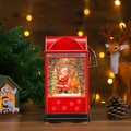 Detail of red vintage gas station snow globe with Santa and reindeer scenery - Santa and Reindeer