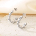 Macro detail of C-shaped silver earrings with pearls on textured stone and satin - Steel 27*4.5mm (KE115664-KFC)