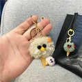 Plush ice cream cone keychain with cute monster face on a black bag - Single Piece / Camel