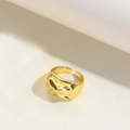 Macro detail of the golden hammered texture and lava-style irregular surface on this ring - Irregular Bumpy Texture