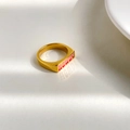 Macro view of gold signet ring with red and pink HOWDY text on white background - US 7 / HOWDY Letter